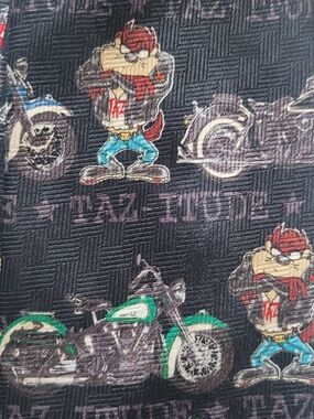 TIE. Warner Bros. Looney Tunes Taz Biker Cartoon Tie with Red and Yellow Logo